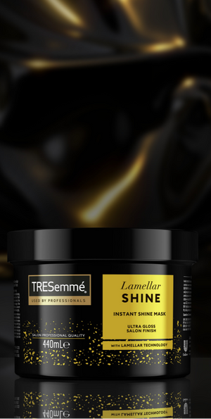 TRESemmé Lamellar Shine hair mask jars with gold accents on a black background